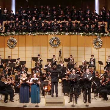 UBC Symphony Orchestra & UBC Choirs performing on stage