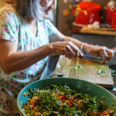 Person preparing a salad