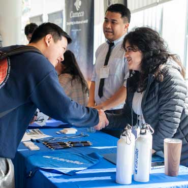 People engaging at a career fair