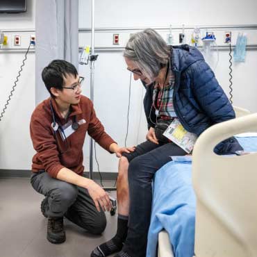 Health care worker helping patient at a clinic.