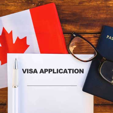 Image showing Canada flag, visa application and passport.