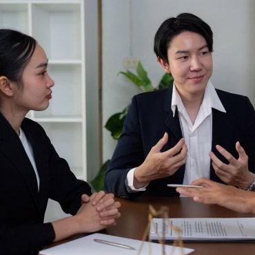 Colleagues sitting at a table for discussion.